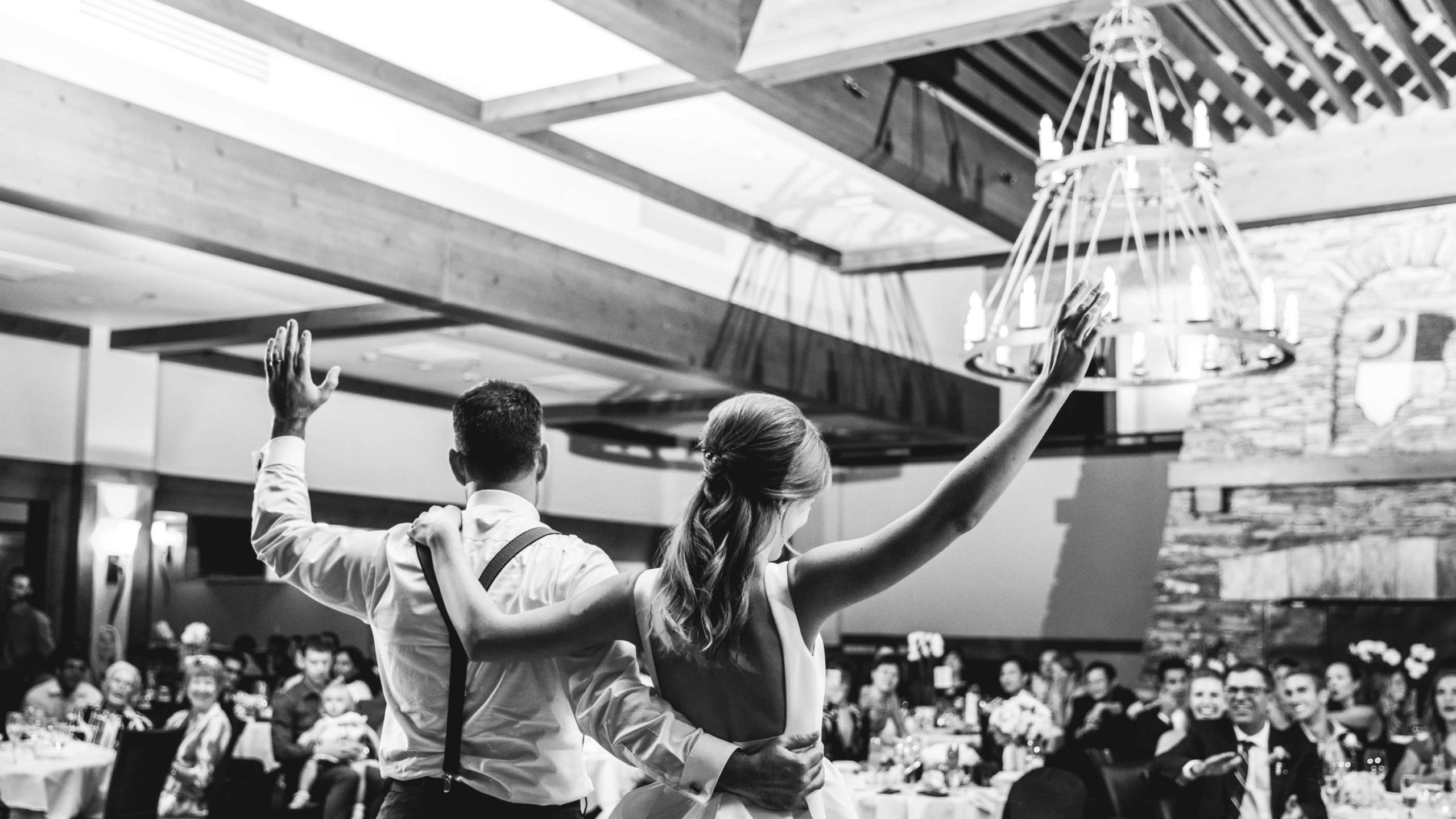 Wedding couple greets guests at reception